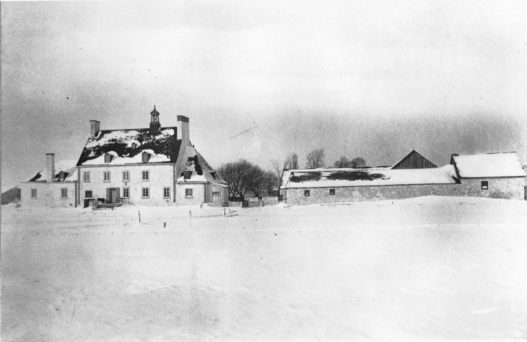 Ferme Saint-Gabriel, seen from the edge of the river, in 1865.   