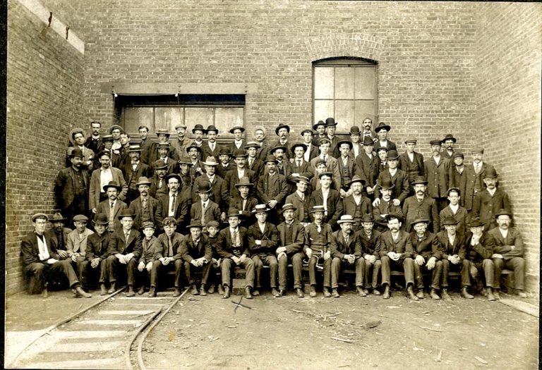 Group of workers in front of the Northern Electric building